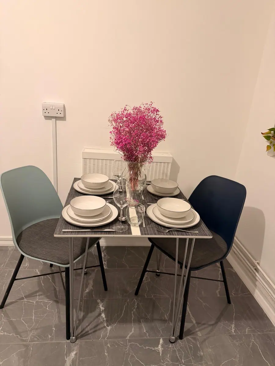 Breakfast table, laid for two